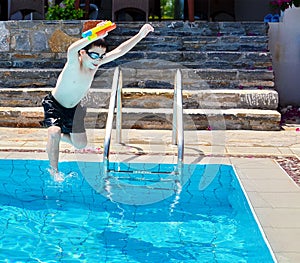 Boy jumping into the Pool