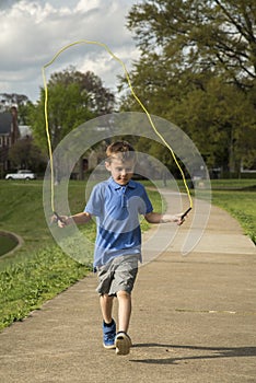Boy Jumping Rope in the Park