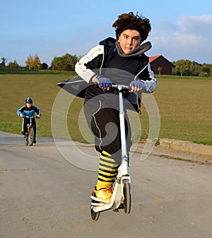 Boy jumping on scooter