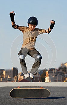 Boy Jumping from Skateboard