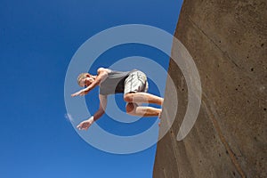 Boy Jumping Somersault Blue Parkour