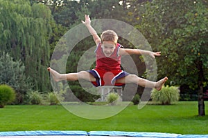 Boy Jumping on trampoline