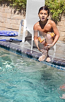 Boy Jumps into the Pool