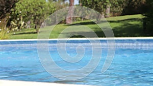 Boy Jumps Into Swimming Pool Then Swims Across Pool