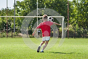 Boy kicking footbal