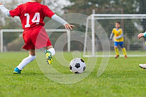 Boy kicking soccer ball