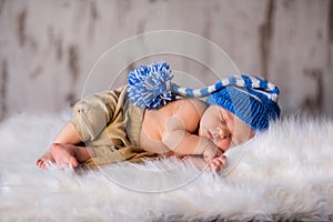 Boy kid newborn sleeping in blue hat