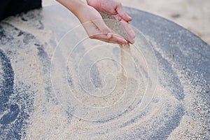 Boy kid playing with sand on the playground, the concept of the development of fine motor skills, tactile sensations, creativity,