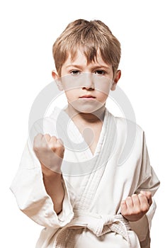 Boy in kimono training karate