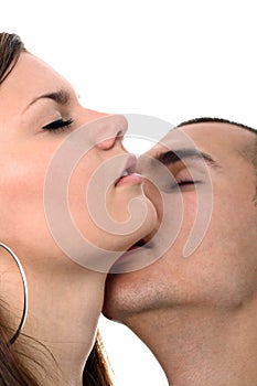 Boy kisses his girl's neck passionately isolated