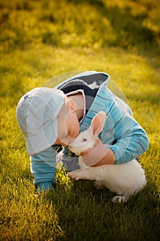 Boy kissing his first bunny