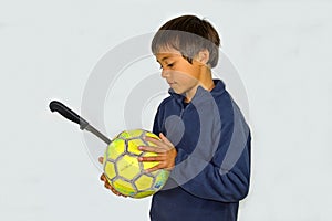Boy With A Knife Punctured Football Ball