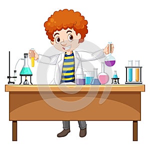 a boy in laboratory coat holding a flaskt on table