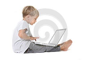 Boy with laptop over white