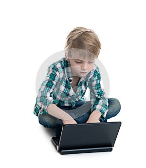 Boy with the laptop on a white background