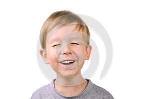 Boy laughing with eyes closed
