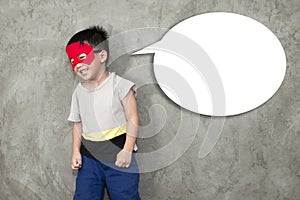The boy Laughing shy dressed up in a superhero has a popup for a message on his side.