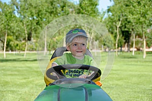 Boy on lawnmower