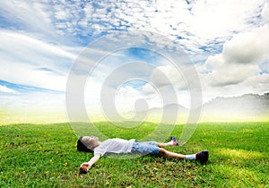 Boy lay on the grass feel relax