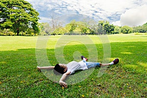 Boy lay on the grass feel relax
