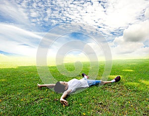 Boy lay on the grass feel relax