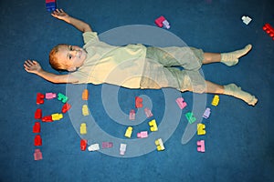 Boy laying on floor