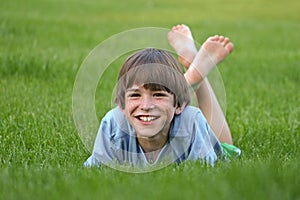 Boy laying in Grass