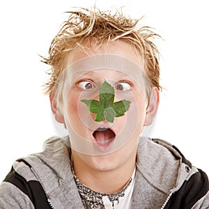 Boy with leaf on his nose photo