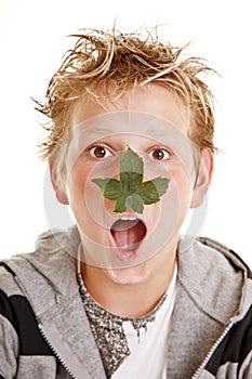 Boy with leaf on his nose