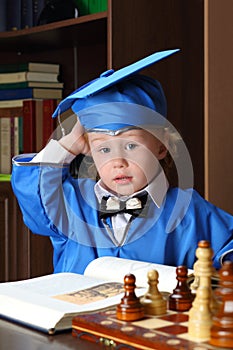 Boy leafs through a book