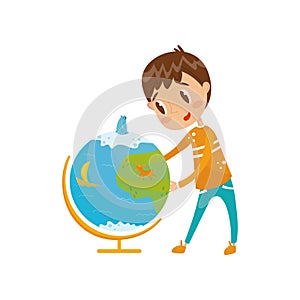 Boy learning geography with big school globe, preschool activities and early childhood education concept vector