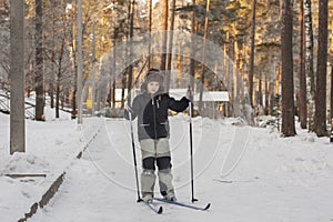 Boy learning ski in forest
