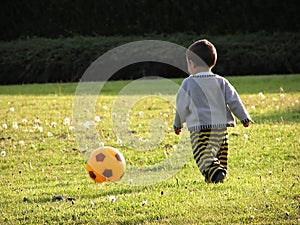 Boy learning soccer