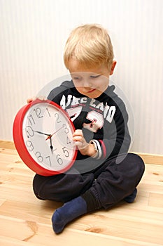 Boy learning to know the clock