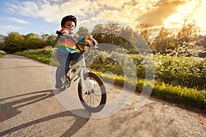 Boy learning to ride his bike