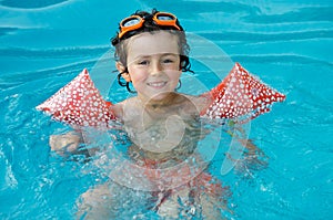 Boy learning to swim