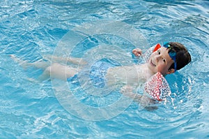 Boy learning to swim