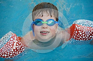 Boy learning to swim