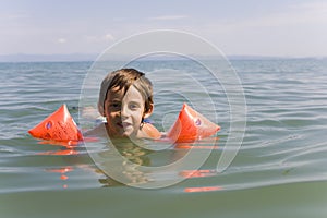 Boy learns swiming