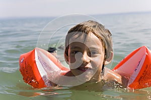 Boy learns swiming