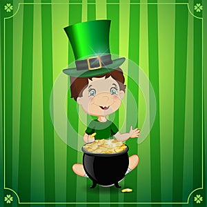 Boy in leprechaun cosume with cauldron gold