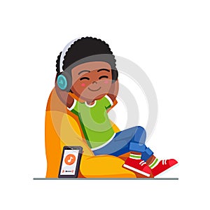 Boy listening to music with wireless headphones