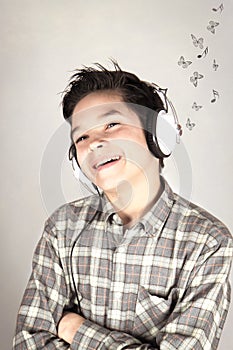 Boy listening to pop music photo