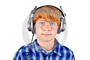 Boy listens to music with his headphones