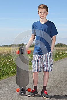 Boy with longboard photo