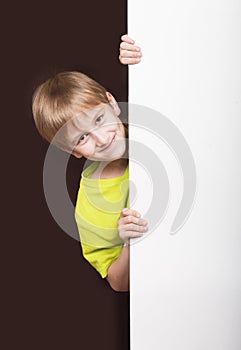 Boy looking around the corner