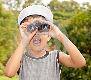 Boy looking through binoculars