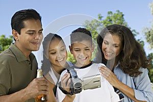 Boy looking into camcorder