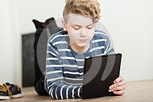 Boy looking at computer tablet