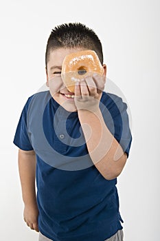 Boy Looking Through Donut